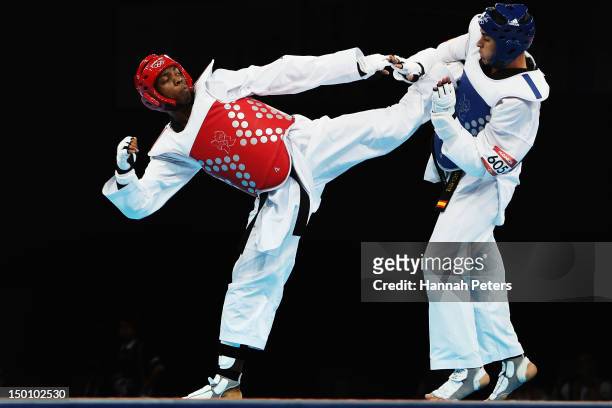 Lutalo Muhammad of Great Britain competes against Nicolas Garcia Hemme of Spain during the Men's -80kg Taekwondo quarterfinal on Day 14 of the London...