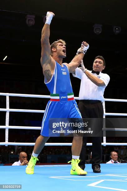 Clemente Russo of Italy reacts after he was declared the winner against Teymur Mammadov of Azerbaijan during the Men's Heavy Boxing bout on Day 14 of...