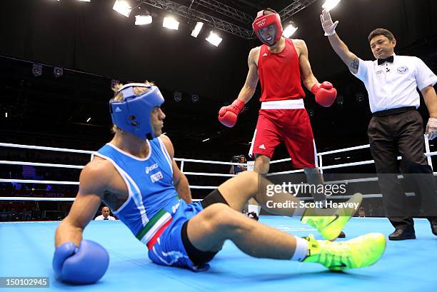 Teymur Mammadov of Azerbaijan cstands over Clemente Russo of Italy during the Men's Heavy Boxing bout on Day 14 of the London 2012 Olympic Games at...