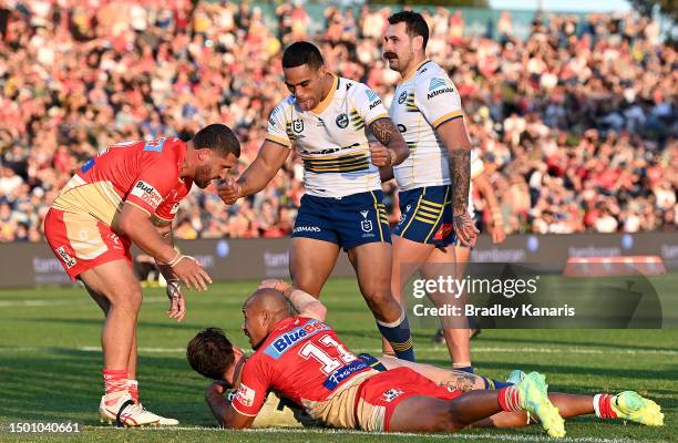 Joe Ofahengaue of the Eels celebrates a try by team mate Clint Gutherson of the Eels during the round 17 NRL match between the Dolphins and...