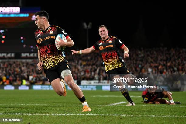 Shaun Stevenson of the Chiefs charges over the tryline to score during the Super Rugby Pacific Final match between Chiefs and Crusaders at FMG...