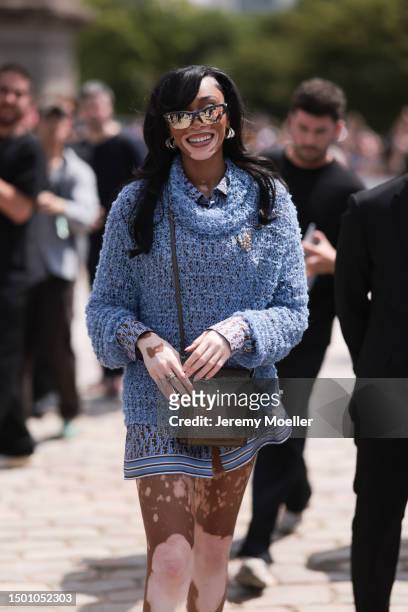 Winnie Harlow is seen wearing a blue mesh turtleneck sweater, Dior monogram baby blue brown flanell and silk shorts outside Dior Homme during the...
