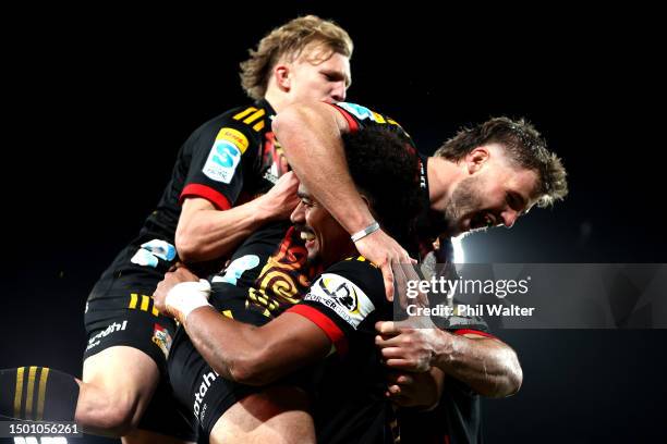 Emoni Narawa of the Chiefs celebrates with his team after scoring a try during the Super Rugby Pacific Final match between Chiefs and Crusaders at...