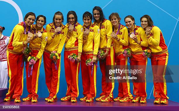 Bronze medallists Spain pose on the podium during the medal ceremony for the Women's Teams Synchronised Swimming Free Routine final on Day 14 of the...