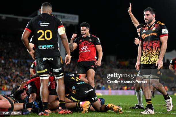 Leicester Fainga'anuku of the Crusaders celebrates a try scored by Codie Taylor during the Super Rugby Pacific Final match between Chiefs and...