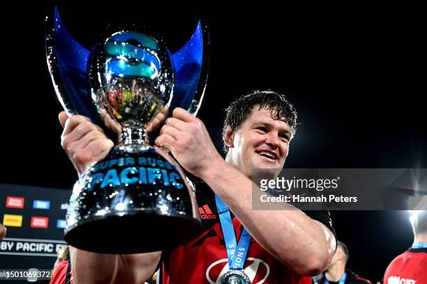 Scott Barrett holds the Super Rugby Pacific trophy after winning the Super Rugby Pacific Final match between Chiefs and Crusaders at FMG Stadium...