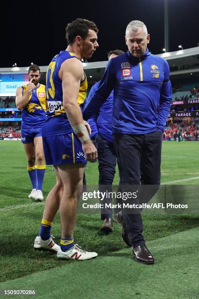 Eagles head coach Adam Simpson talks to captain Luke Shuey of the Eagles as they walk from the field after defeat during the round 15 AFL match...