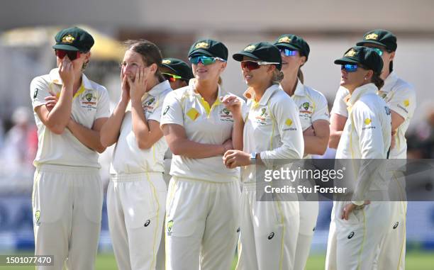 Australia bowler Darcie Brown and team mates watch the big screen after taking the wicket of Natalie Sciver-Brunt with the first ball of the day, the...