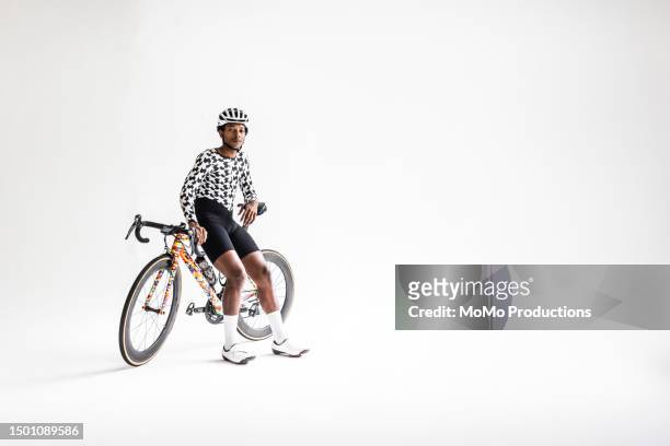 studio portrait of young male cyclist on white background - man white background stock pictures, royalty-free photos & images