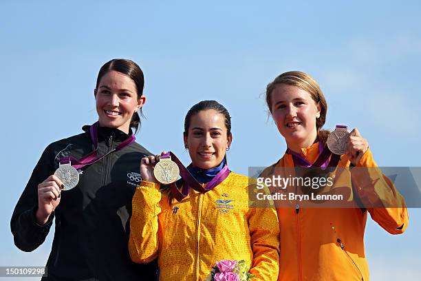 Silver medallist Sarah Walker of New Zealand, Gold medallist Mariana Pajon of Colombia, and Bronze medallist Laura Smulders of the Netherlands...