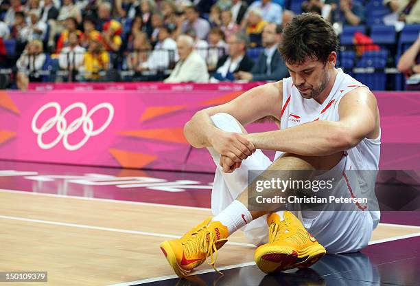 Marc Gasol of Spain reacts as he sits on the baseline in the first half while taking on Russia during the Men's Basketball semifinal match on Day 14...