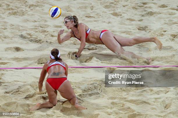 Kerri Walsh Jennings of the United States dives for the ball during the Women's Beach Volleyball Gold medal match against the United States on Day 12...