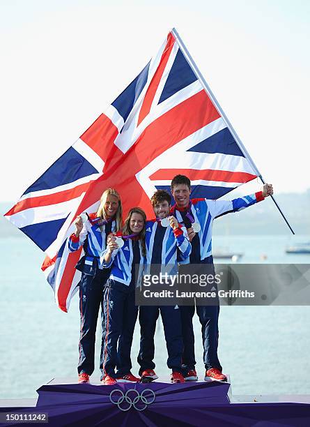 Women's sailors Saskia Clark and Hannah Mills of Great Britain and 470 Men's sailors Luke Patience and Stuart Bithell of Great Britain celebrate...