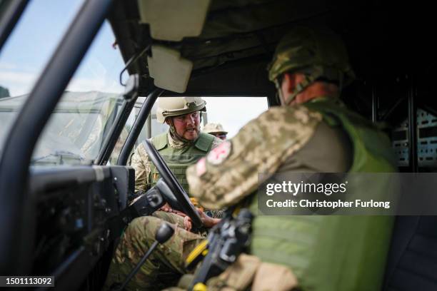 Ukrainian combat medic Sasha administers first aid to an exercise casualty during the first combat medical training course in the UK to Ukrainian...