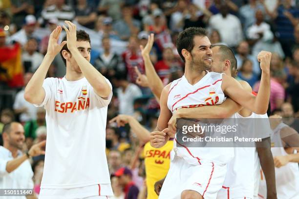 Jose Calderon of Spain celebrates with teammates after they defeated Russia 67-59 during the Men's Basketball semifinal match on Day 14 of the London...