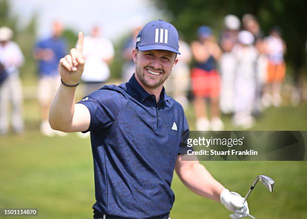 Connor Syme of Scotland celebrates his hole in one on the second hole during Day Three of the BMW International Open at Golfclub Munchen Eichenried...
