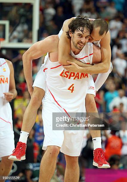 Pau Gasol and Sergio Rodriguez of Spain celebrate after they won 67-59 against Russia during the Men's Basketball semifinal match on Day 14 of the...