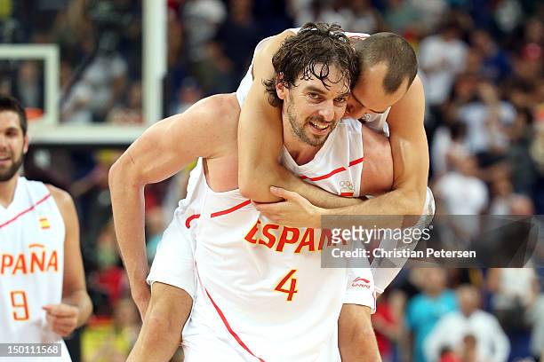 Pau Gasol and Sergio Rodriguez of Spain celebrate after they won 67-59 against Russia during the Men's Basketball semifinal match on Day 14 of the...