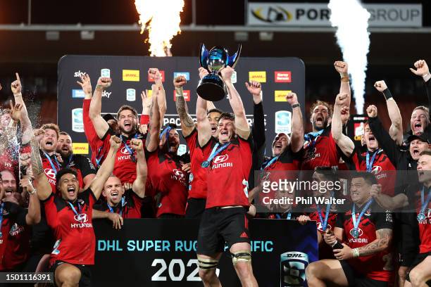 Scott Barrett holds the Super Rugby Pacific trophy as the Crusaders celebrate after winning the Super Rugby Pacific Final match between Chiefs and...