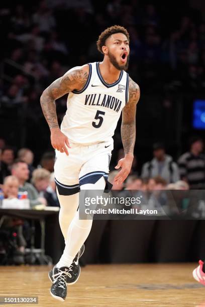Justin Moore of the Villanova Wildcats celebrates a shot during the first round of the Big East Basketball Tournament against the Georgetown Hoyas at...