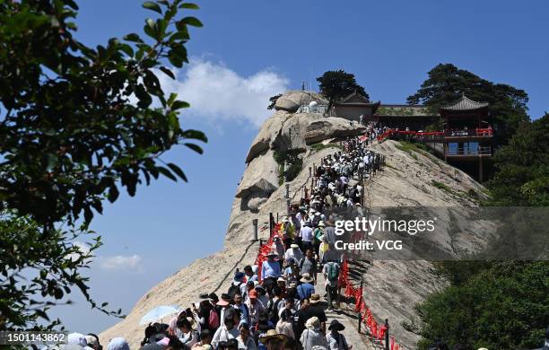 Tourists visit the Mount Hua during Dragon Boat Festival holiday on June 23, 2023 in Huayin, Weinan City, Shaanxi Province of China.