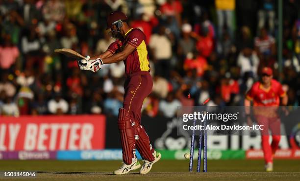 Roston Chase of West Indies is bowled by Tendai Chatara of Zimbabwe during the ICC Men's Cricket World Cup Qualifier Zimbabwe 2023 match between...