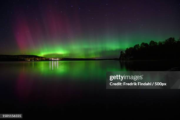 scenic view of lake against sky at night,sweden - väder stock pictures, royalty-free photos & images