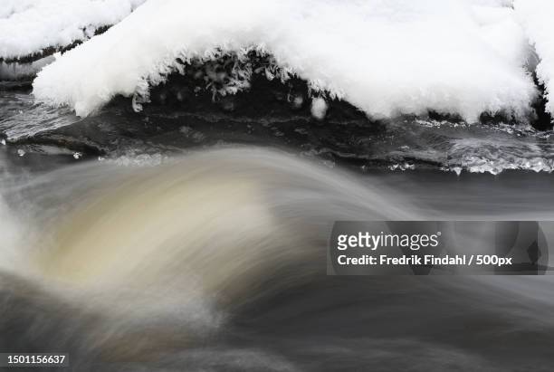 close-up of water flowing through rocks,sweden - vatten stock-fotos und bilder