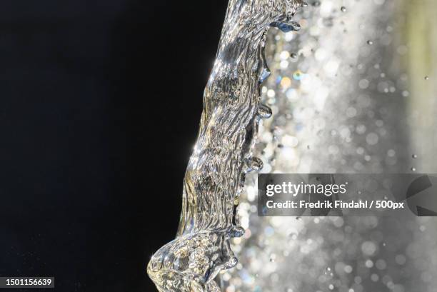 close-up of water splashing against black background,sweden - vätska stock pictures, royalty-free photos & images