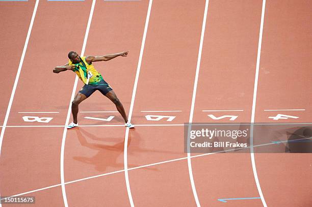 Summer Olympics: Jamaica Usain Bolt victorious, posing after winning Men's 200M Final gold at Olympic Stadium. London, United Kingdom 8/9/2012...