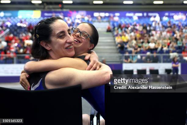 Valeria Nardo of Italy reacts with her team mate Giovanna Angela Demurtas after her Vaulting during the Gymnastic competition at Messe Berlin on day...