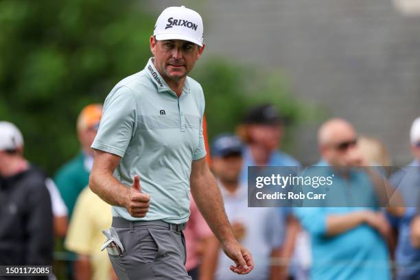 Keegan Bradley of the United States gives a thumbs up as he walks off the first tee during the third round of the Travelers Championship at TPC River...