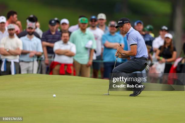Justin Thomas of the United States reacts to a missed putt for birdie on the first hole during the third round of the Travelers Championship at TPC...