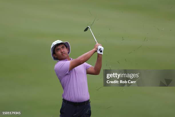 Zecheng Dou of China plays a second shot on the first hole during the third round of the Travelers Championship at TPC River Highlands on June 24,...