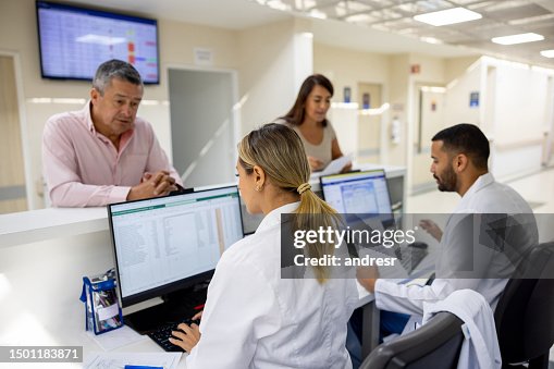 Doctors registering patients at the hospital Doctors registering patients at the hospital