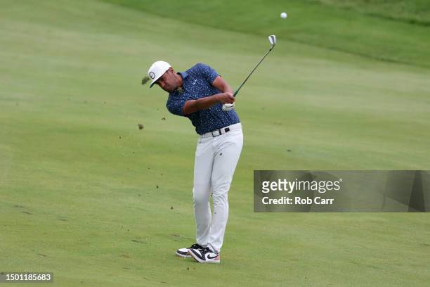 Tony Finau of the United States plays a second shot on the first hole during the third round of the Travelers Championship at TPC River Highlands on...