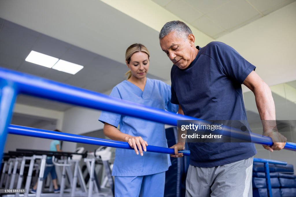 Man doing physical therapy and walking on bars