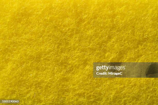 yellow scouring pad close-up texture background - scouring pad stock pictures, royalty-free photos & images