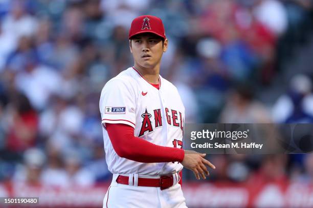 Shohei Ohtani of the Los Angeles Angels looks on during a game against the Los Angeles Dodgers at Angel Stadium of Anaheim on June 21, 2023 in...