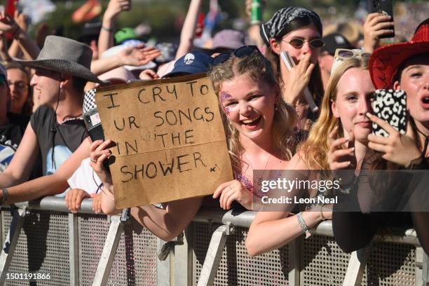 Festival-goer holds up a handwritten sign reading "I Cry To Ur Songs In The Shower" as Lewis Capaldi performs on the Pyramid Stage on Day 4 of...