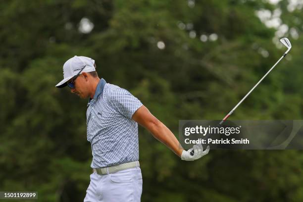 Rickie Fowler of the United States reacts to his tee shot on the fifth hole during the third round of the Travelers Championship at TPC River...
