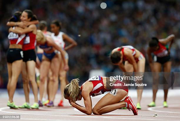 Morgan Uceny of the United States reacts after falling as athletes celebrate behind her during the Women's 1500m Final on Day 14 of the London 2012...