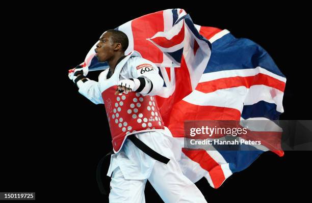 Lutalo Muhammad of Great Britain celebrates winning the Bronze medal in the Men's -80kg Taekwondo Bronze Medal Finals bout against Arman Yeremyan of...