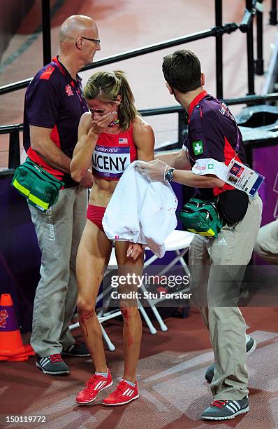 Morgan Uceny of the United States receives assistance after falling and failing to finish in the Women's 1500m Final on Day 14 of the London 2012...