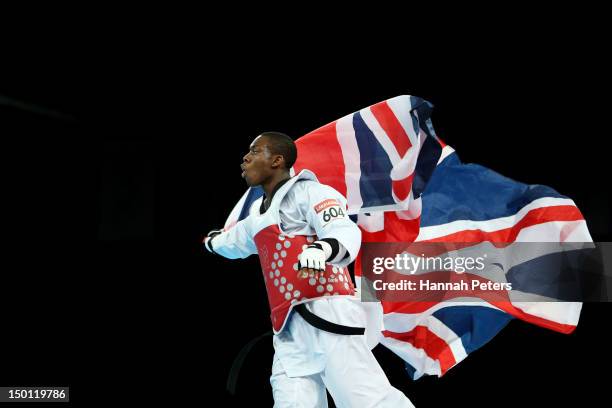 Lutalo Muhammad of Great Britain celebrates winning the Bronze medal in the Men's -80kg Taekwondo Bronze Medal Finals bout against Arman Yeremyan of...