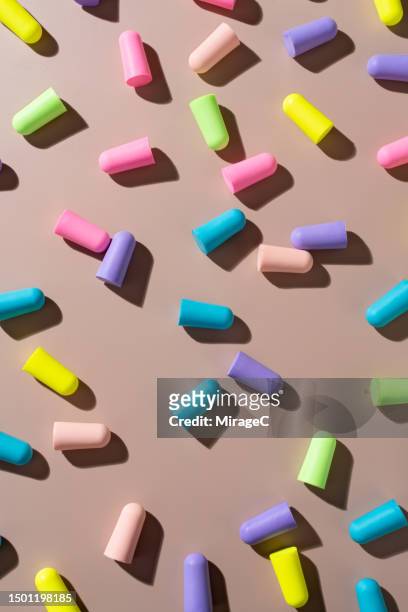 multi colored ear plugs for noise protection - ear plug ear protectors stock pictures, royalty-free photos & images