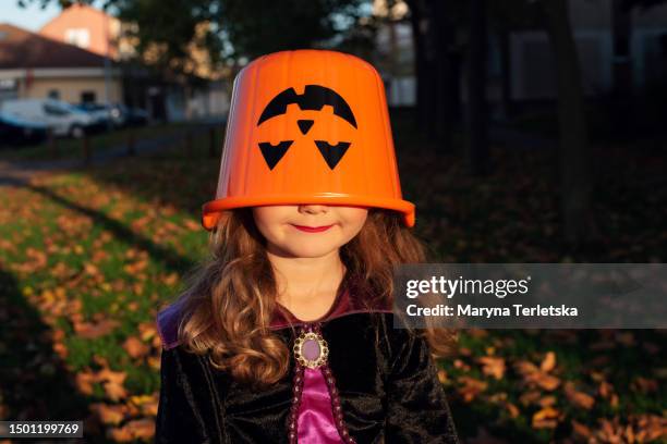 girl in a festive costume outside. halloween. candy or death. pumpkin. holiday. masquerade. - naughty halloween stock pictures, royalty-free photos & images