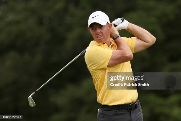 Rory McIlroy of Northern Ireland reacts to his shot from the fifth tee during the third round of the Travelers Championship at TPC River Highlands on...
