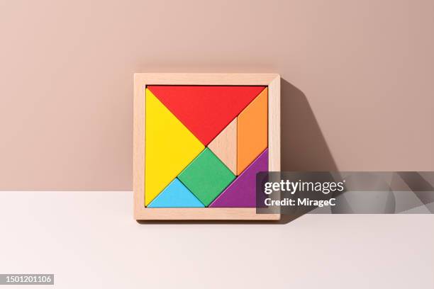 colorful tangram on beige background - tangram foto e immagini stock
