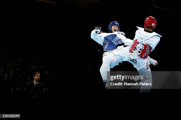 Lutalo Muhammad of Great Britain competes against Arman Yeremyan of Armenia in the Men's -80kg Taekwondo Bronze Medal Finals bout on Day 14 of the...